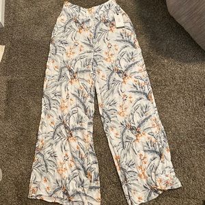 Rip curl size medium, brand new white tropical floral pants.